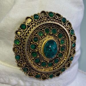 Golden Pendant and brooch with Emerald Green Stones